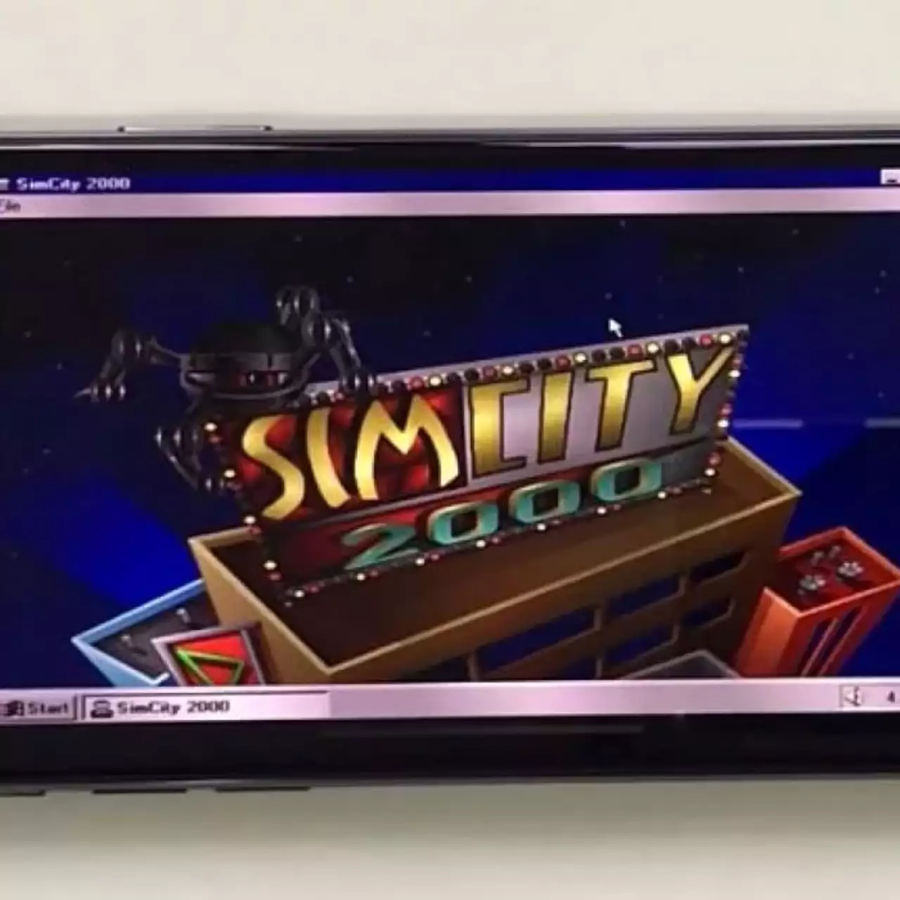 На iPhone X установили Windows 95 и запустили Simcity 2000